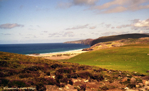 At the end of the path, Sandwood bay lies under the sun