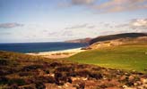 At the end of the path, Sandwood bay lies under the sun